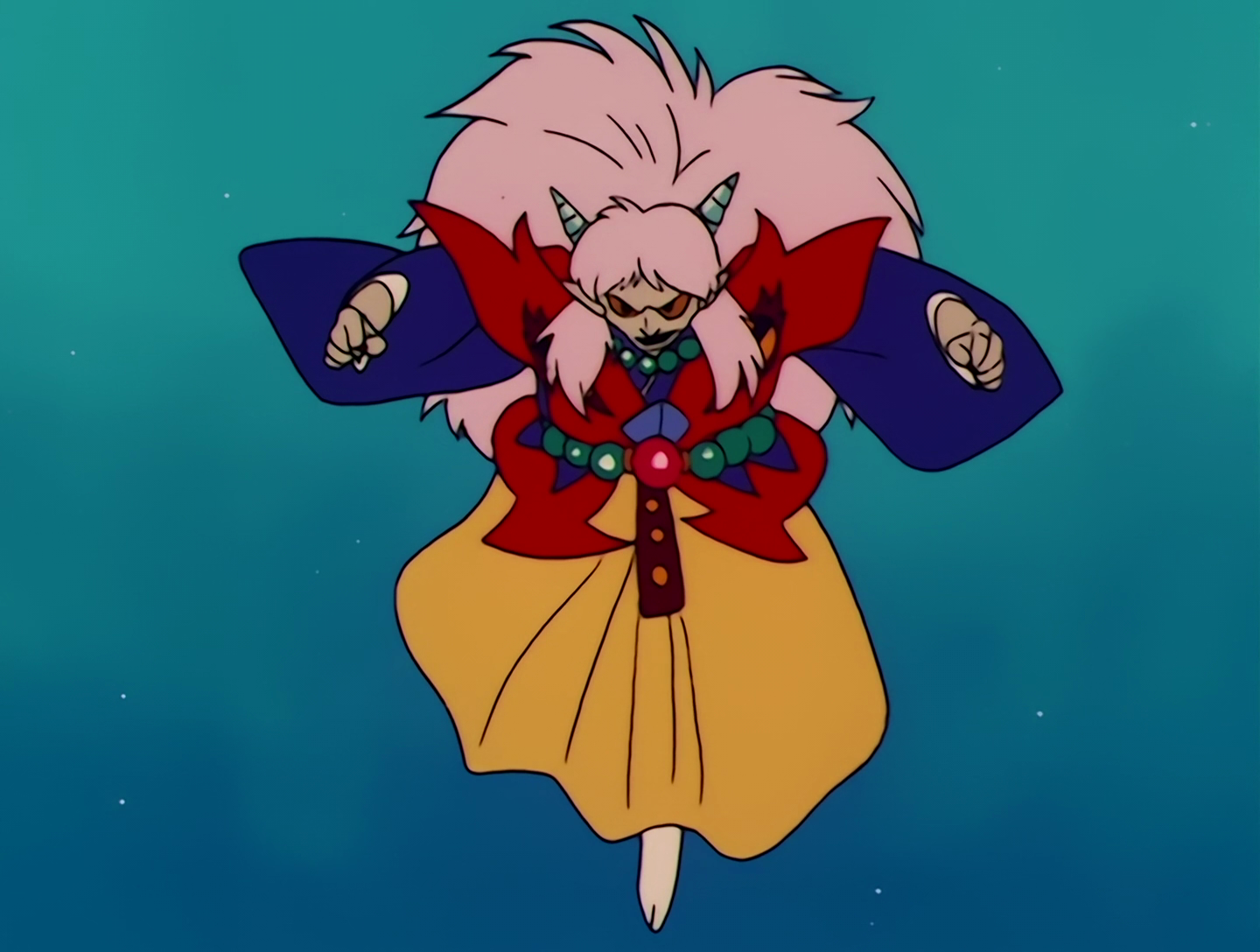 Yasha has now lost the mask. Her skin is now greenish, her face is demonic with yellow eyes, and she has white hair and drill-like horns. The pink parts of her outfit have now been replaced with red.